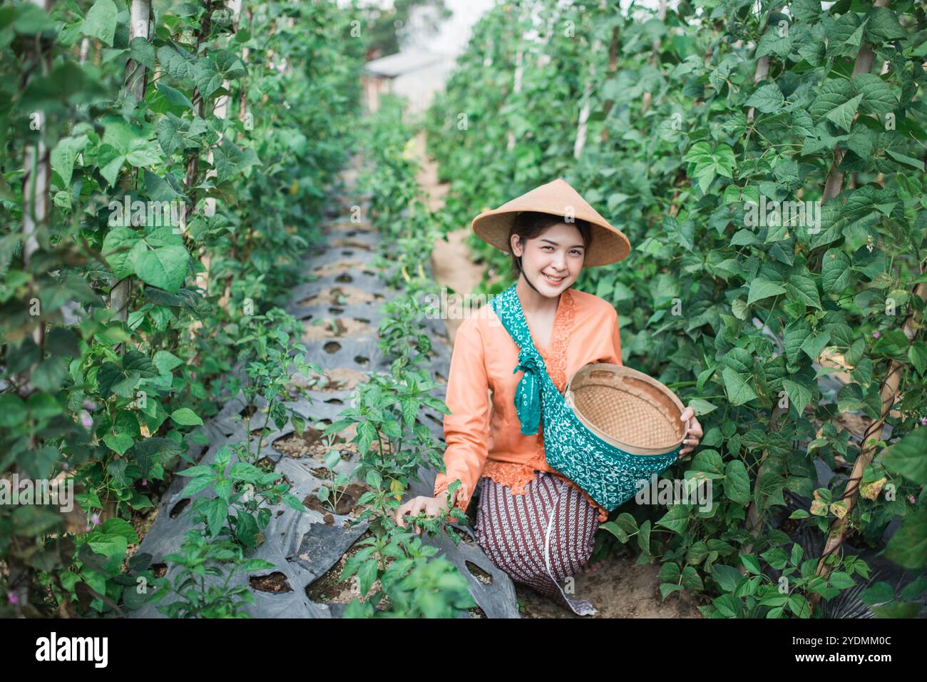 A Happy Smiling Farmer Standing Proudly in a Lush Green Field Wearing a ...