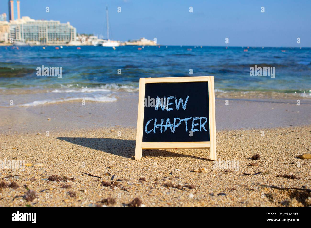 New Chapter symbol. Concept word New Chapter on black chalk background ...