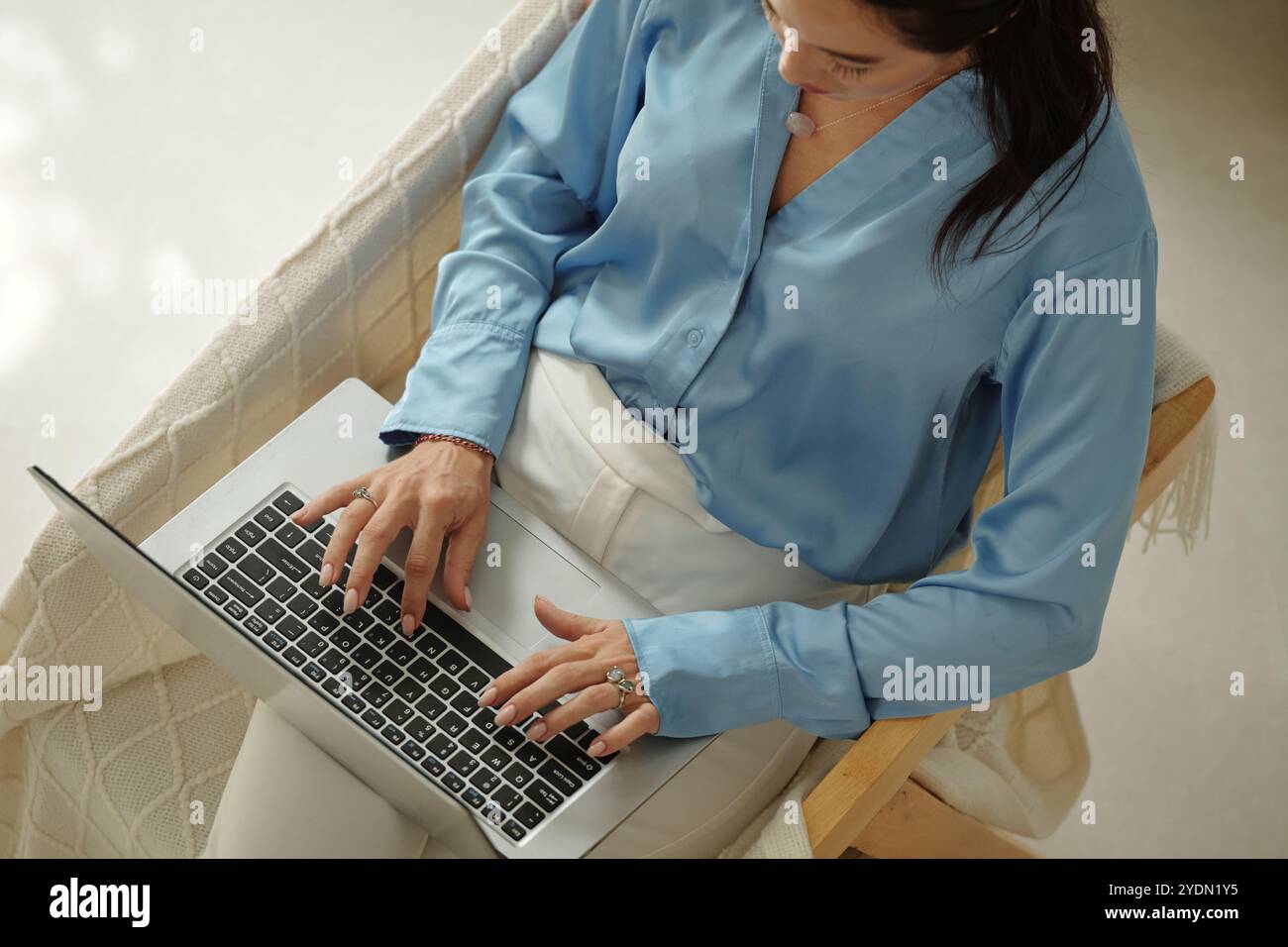 Woman Wearing Blue Shirt Working on Laptop Stock Photo