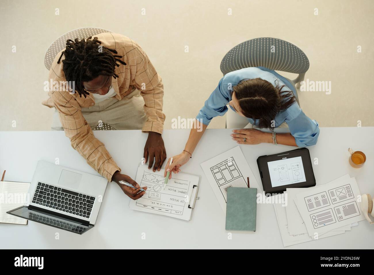 Collaborating on Design Project in Modern Office Stock Photo