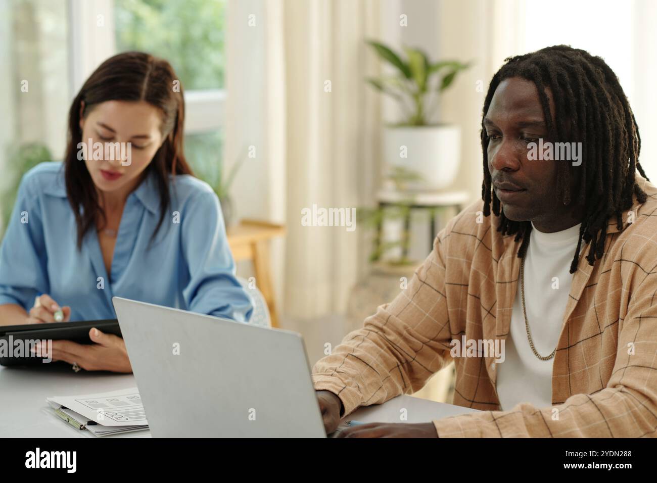 Collaborating on Business Project in Office Setting Stock Photo