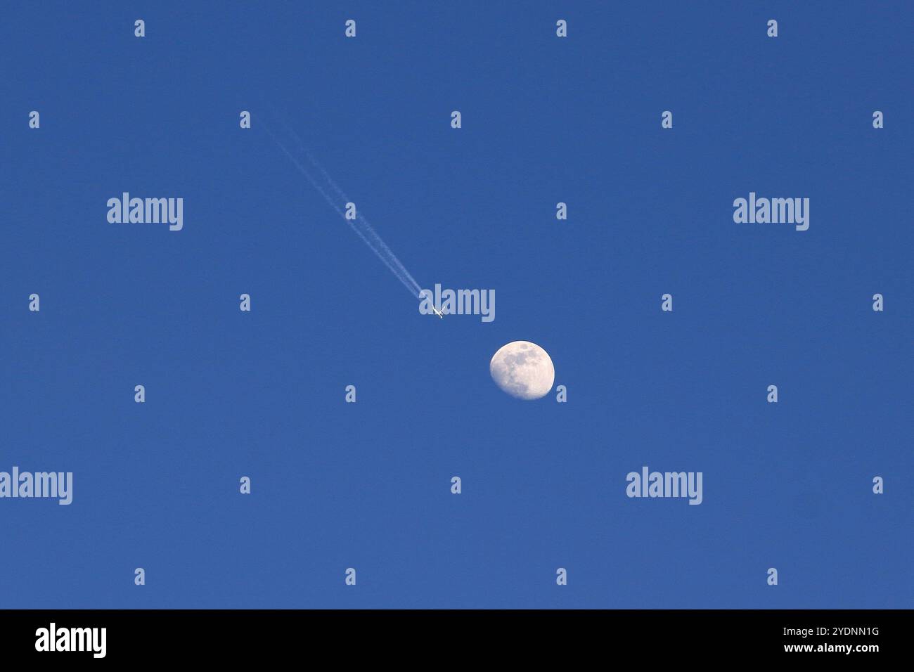 An airplane takes off in front of the full moon Stock Photo - Alamy