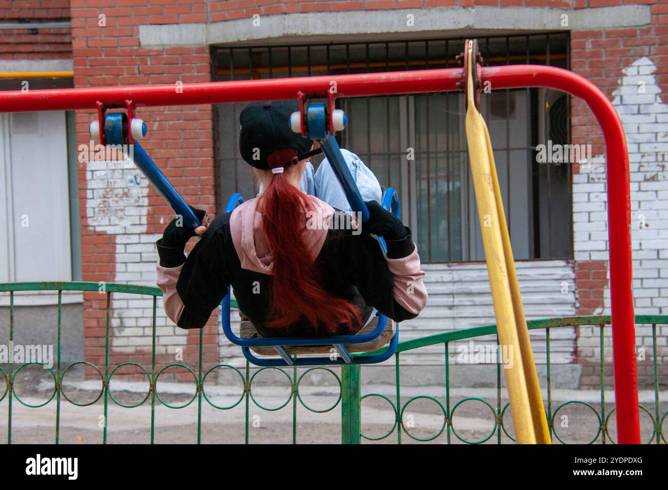 Childhood Teenager on a swing in the playground Samara Samara region Russia Copyright: xSvetlanaxVozmilovax Vozmilova6628 Stock Photo