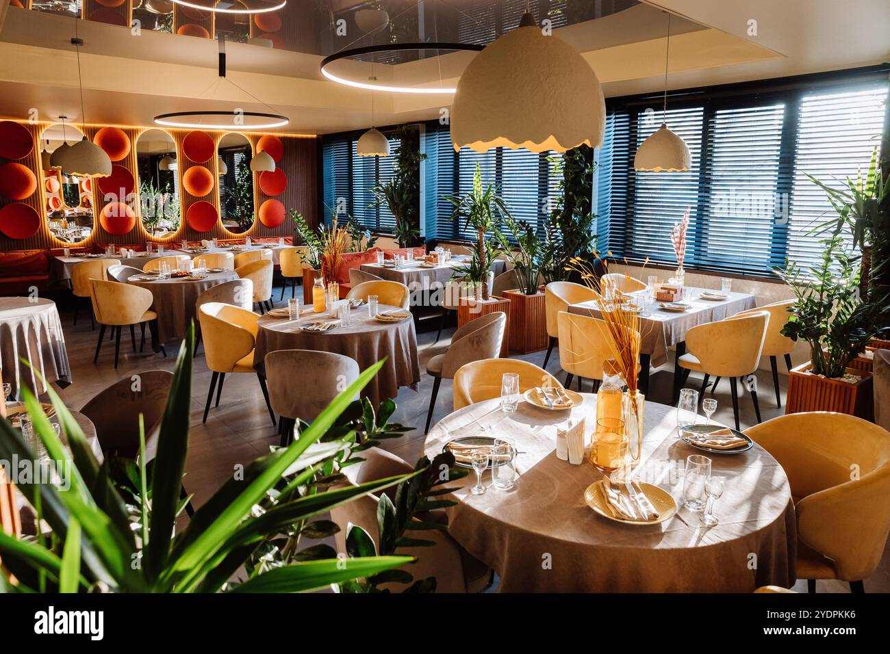 Modern restaurant interior with elegant decor, tables, and lighting ...
