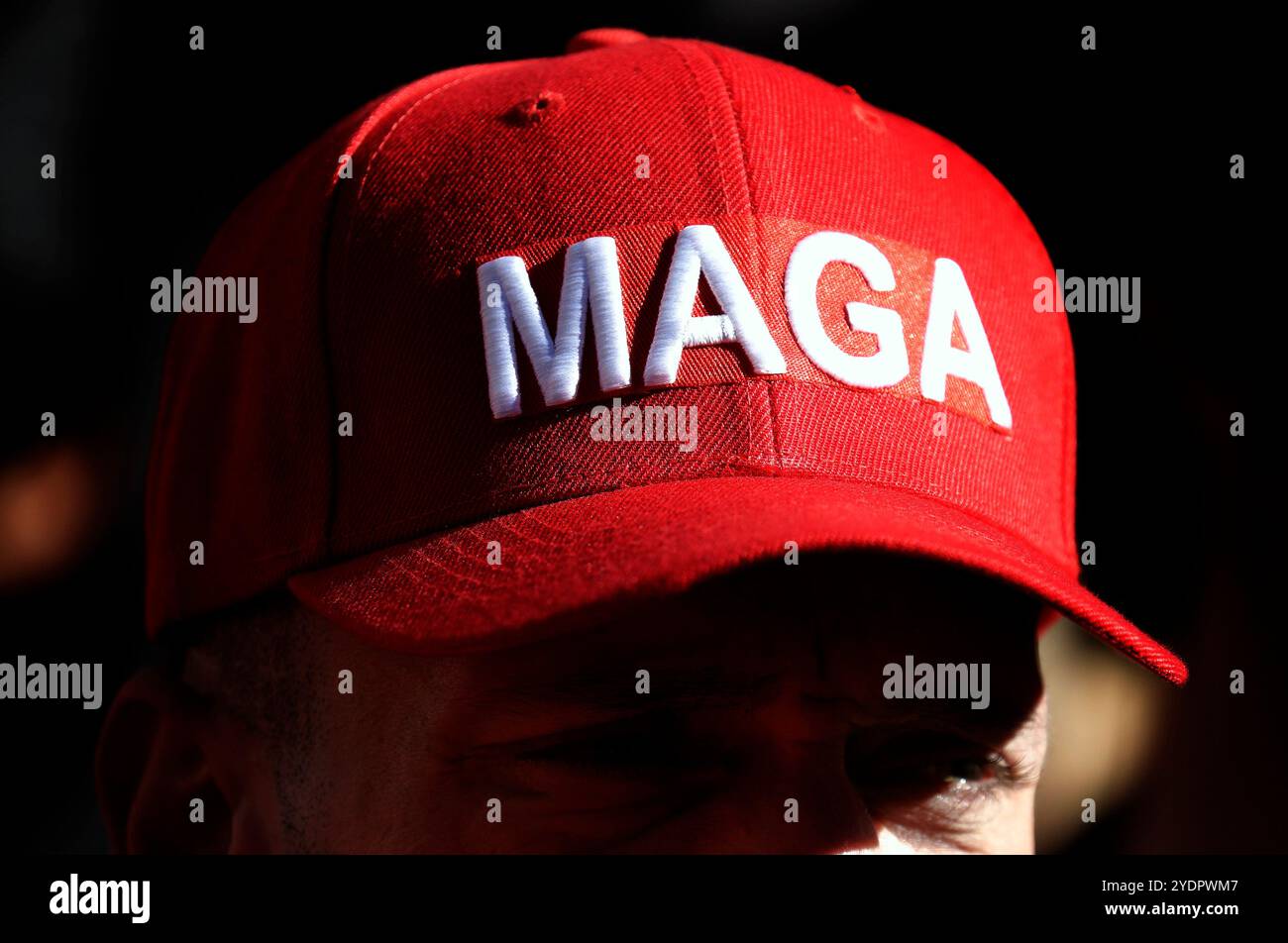 New York, United States. 27th Oct, 2024. A supporter wears a Trump ...