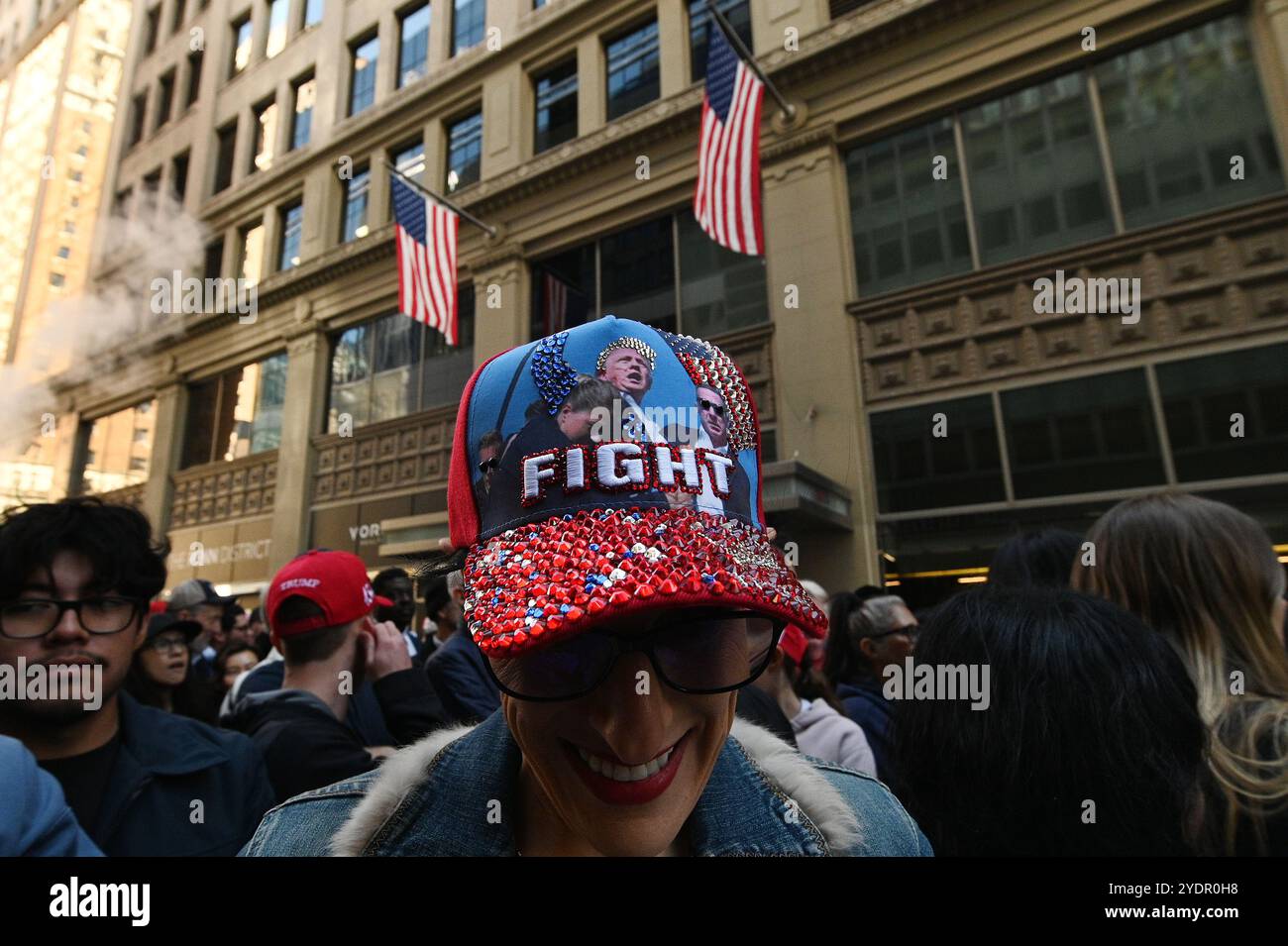 New York, USA. 27th Oct, 2024. Trump supporters line up on 33rd Street ...