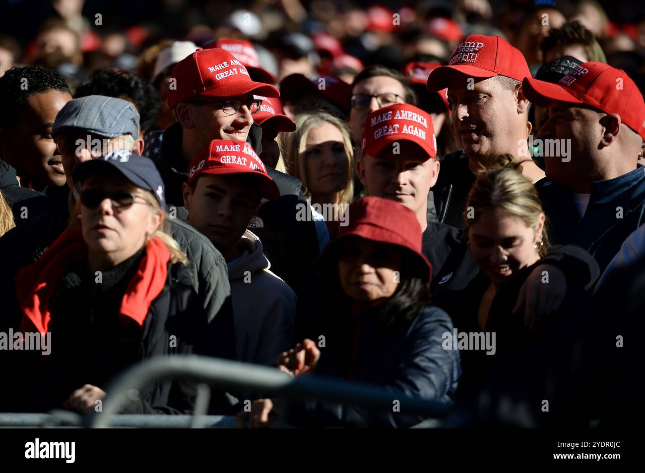 New York, USA. 27th Oct, 2024. Trump supporters line up on 33rd Street ...