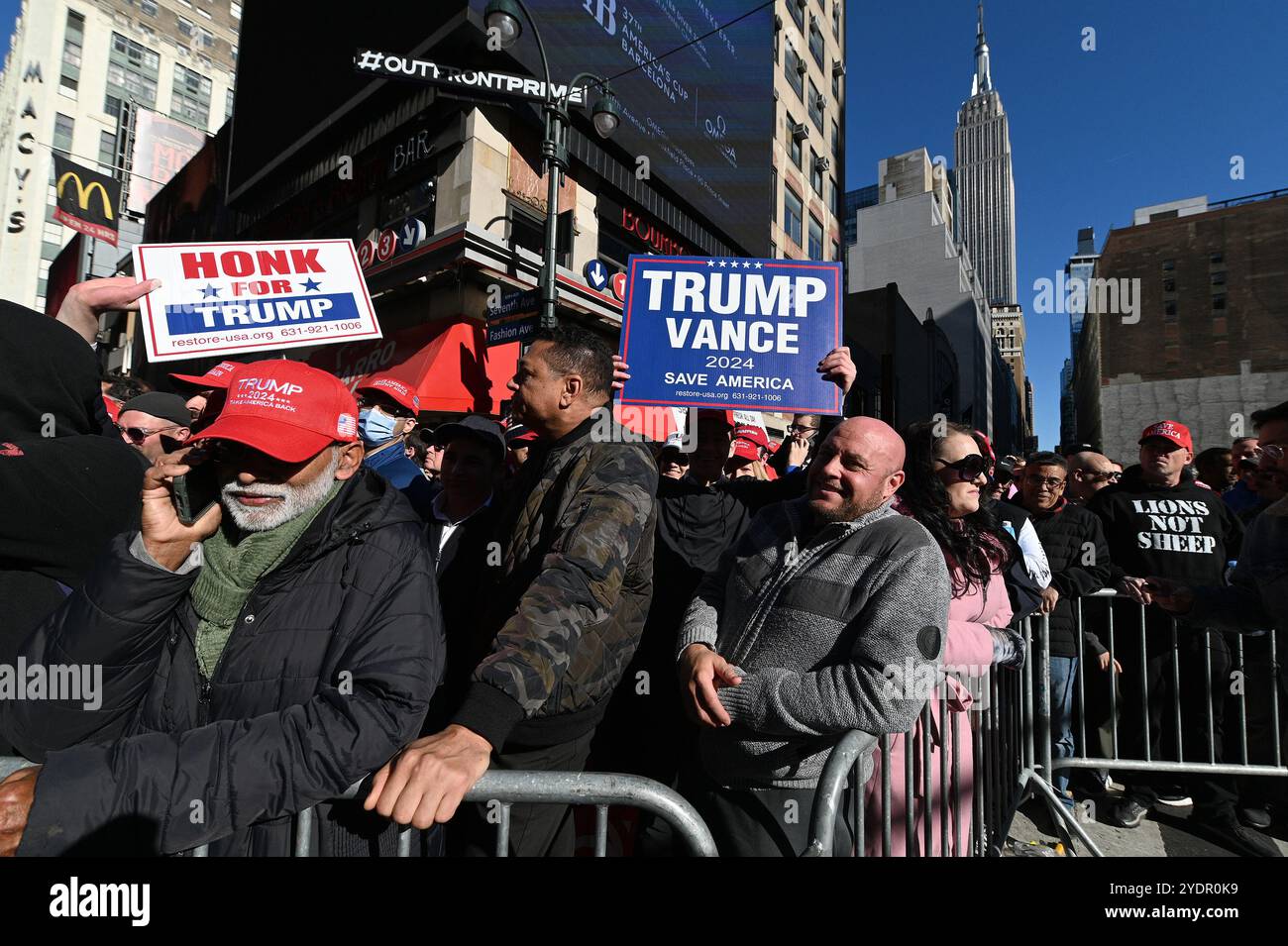 New York, USA. 27th Oct, 2024. Trump supporters line up on 33rd Street ...