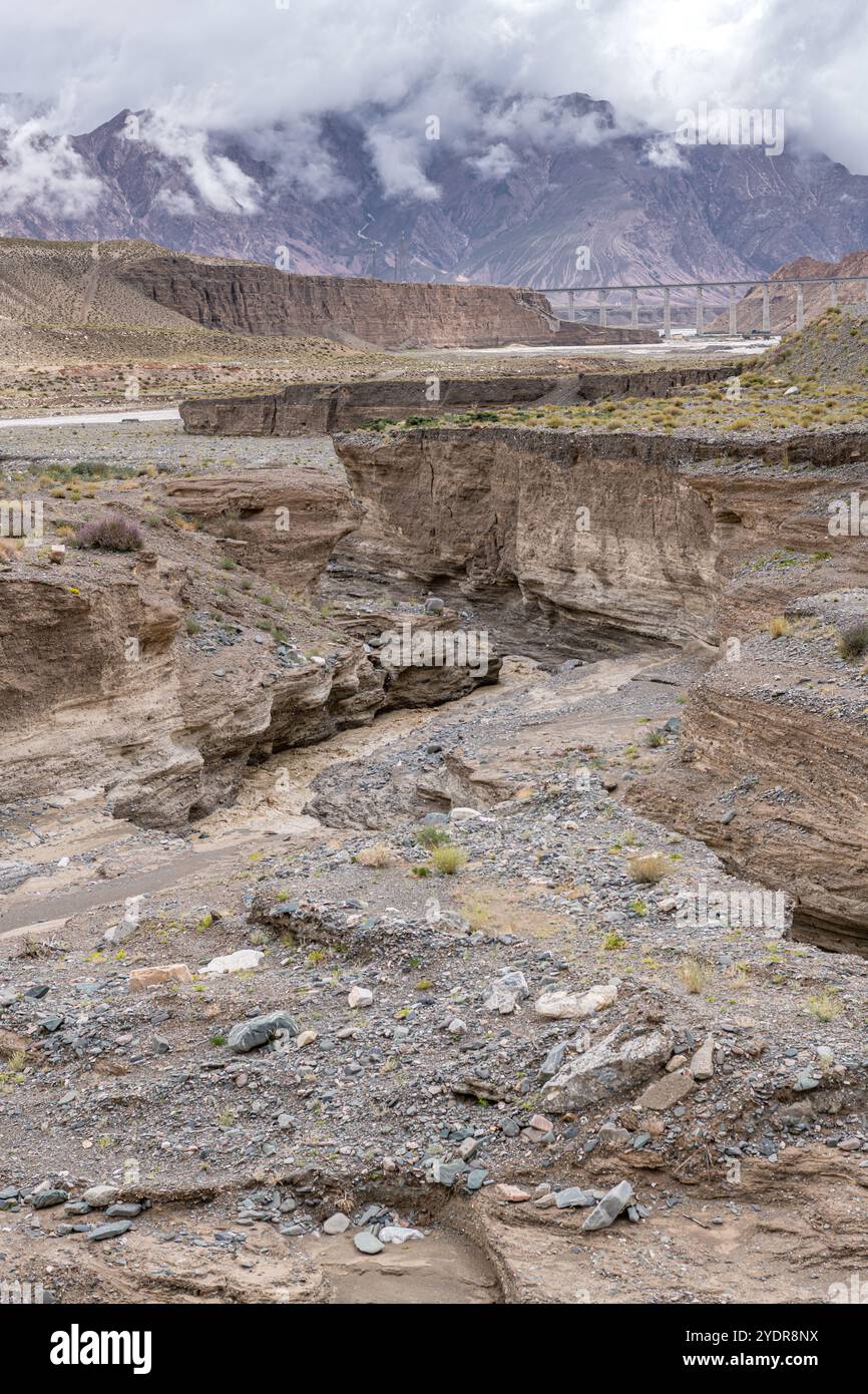 The majestic scenery of Kunlun snow mountains under a cloudy sky, Qinghai, China Stock Photo