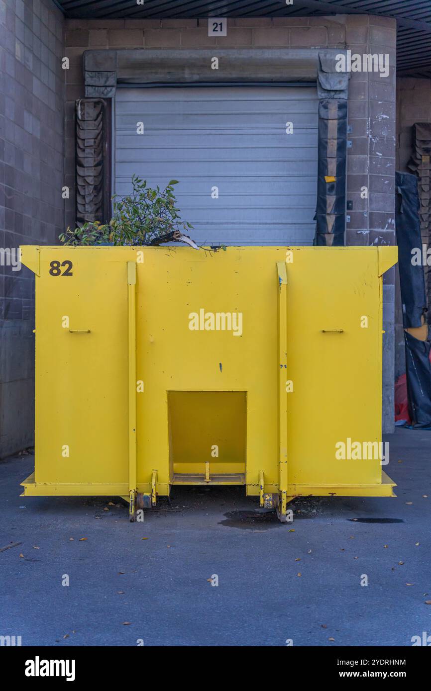 Yellow garbage recycling container hi-res stock photography and images ...