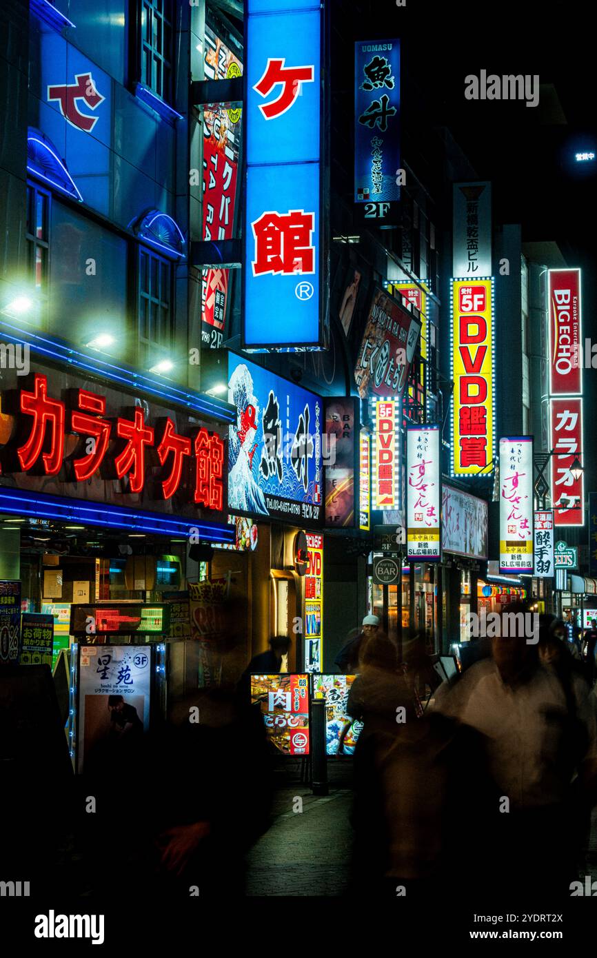 Tokyo, Japan - Shinbashi Salaryman area in central Tokyo illuminated during Rush Hour. Stock Photo
