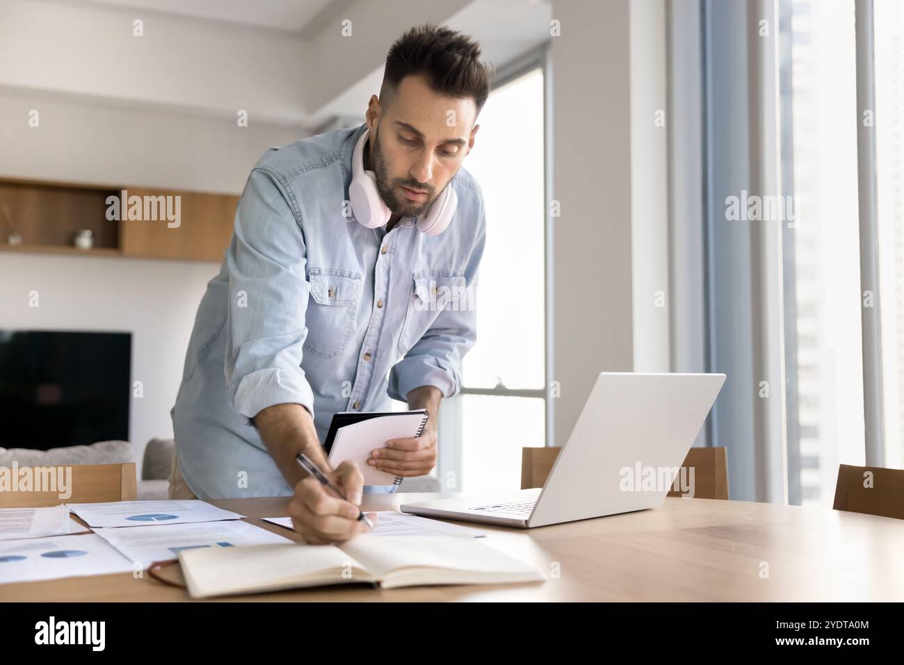 Serious focused project manager man doing research for startup Stock Photo