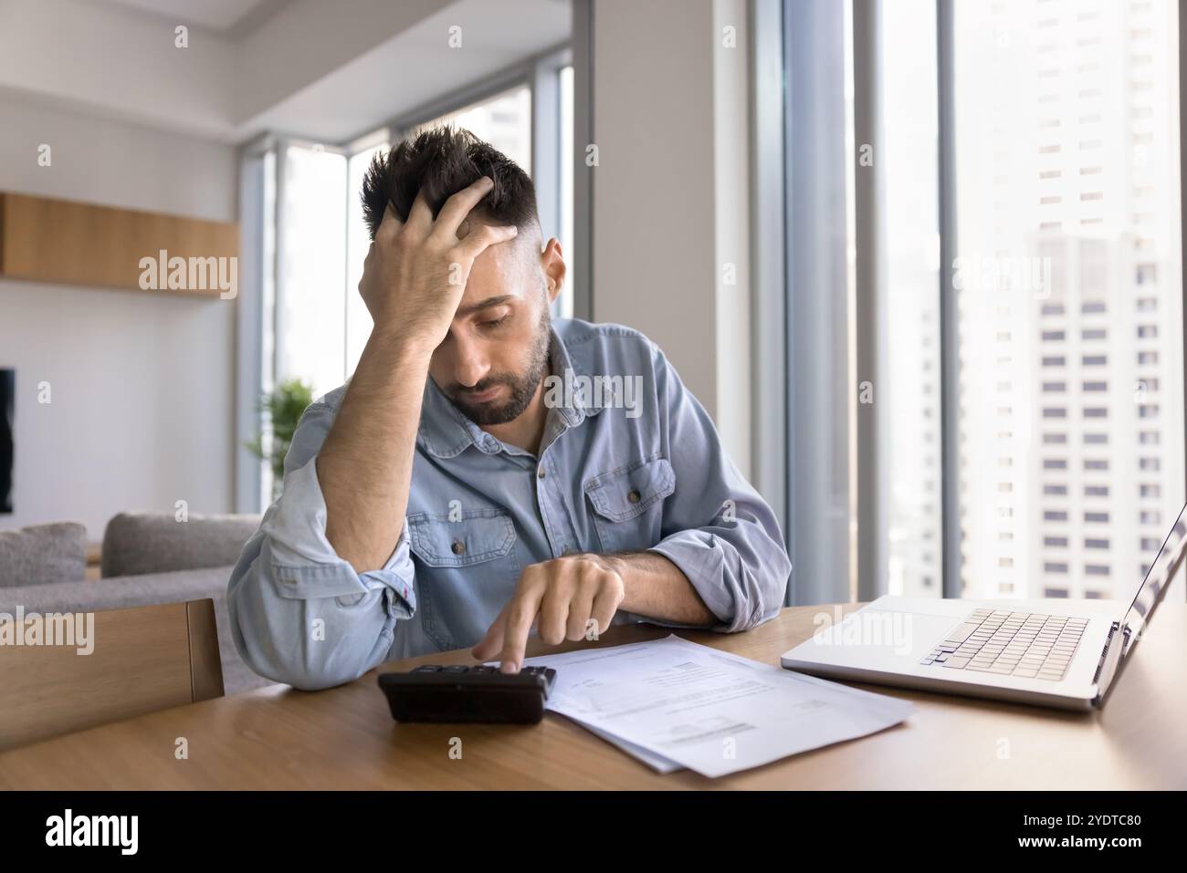 Worried tired freelance businessman getting financial problems Stock Photo