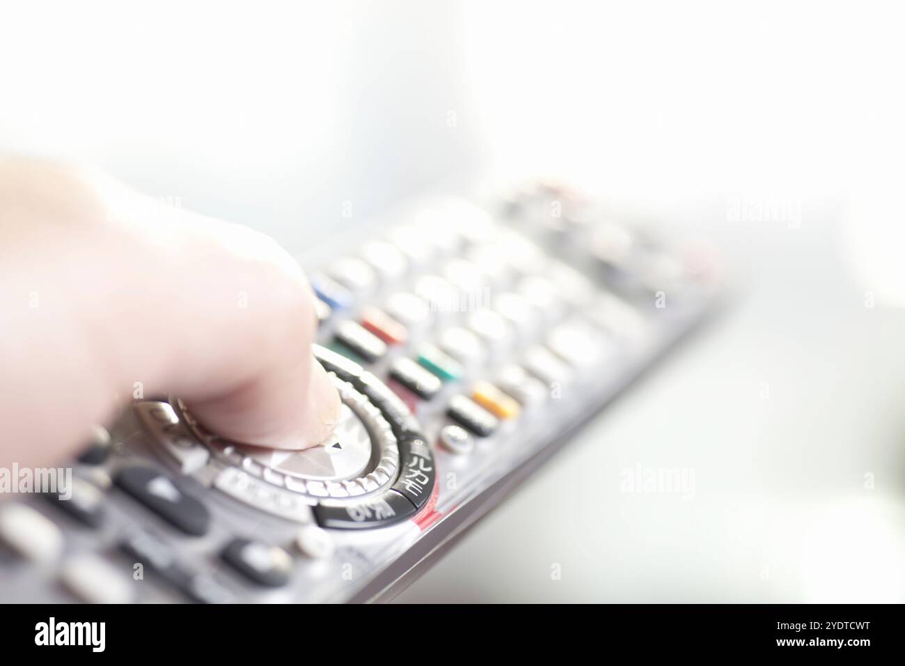 Operating the TV remote control Stock Photo - Alamy