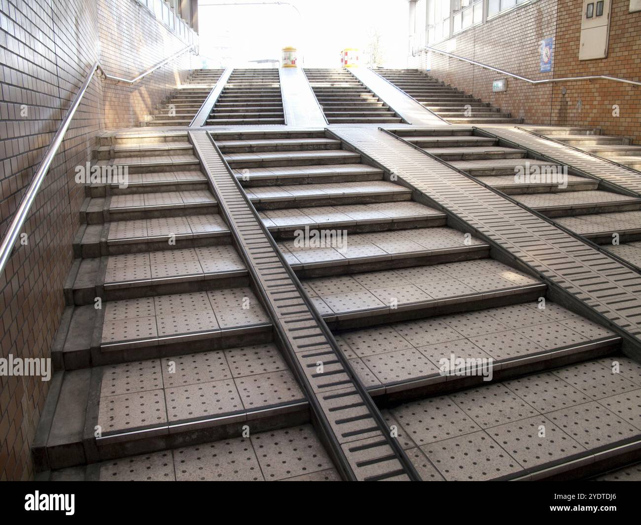 Staircase with ramp leading to underground passage Stock Photo - Alamy