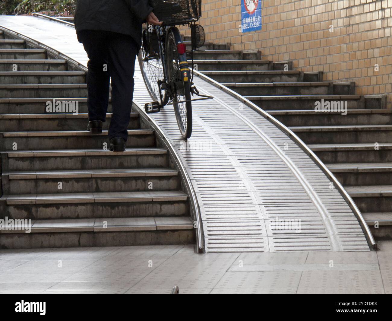 Staircase with ramp leading to underground passage Stock Photo - Alamy