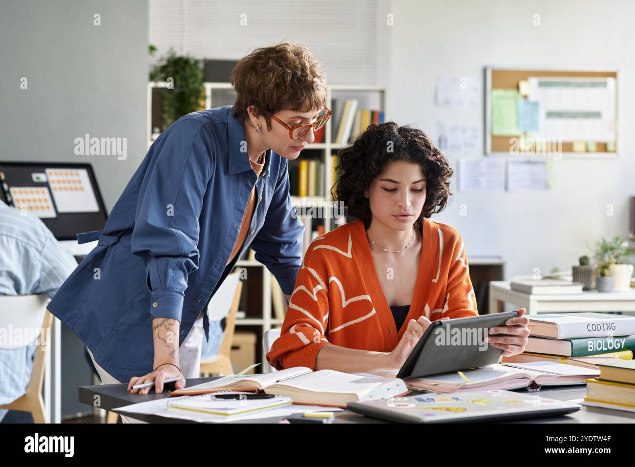Collaborating on a Digital Tablet in an Office Setting Stock Photo