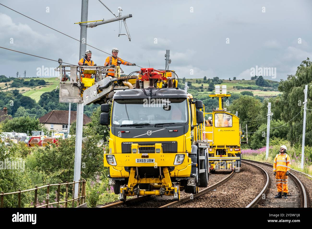 Overhead line maintenance on rail tracks Stock Photo