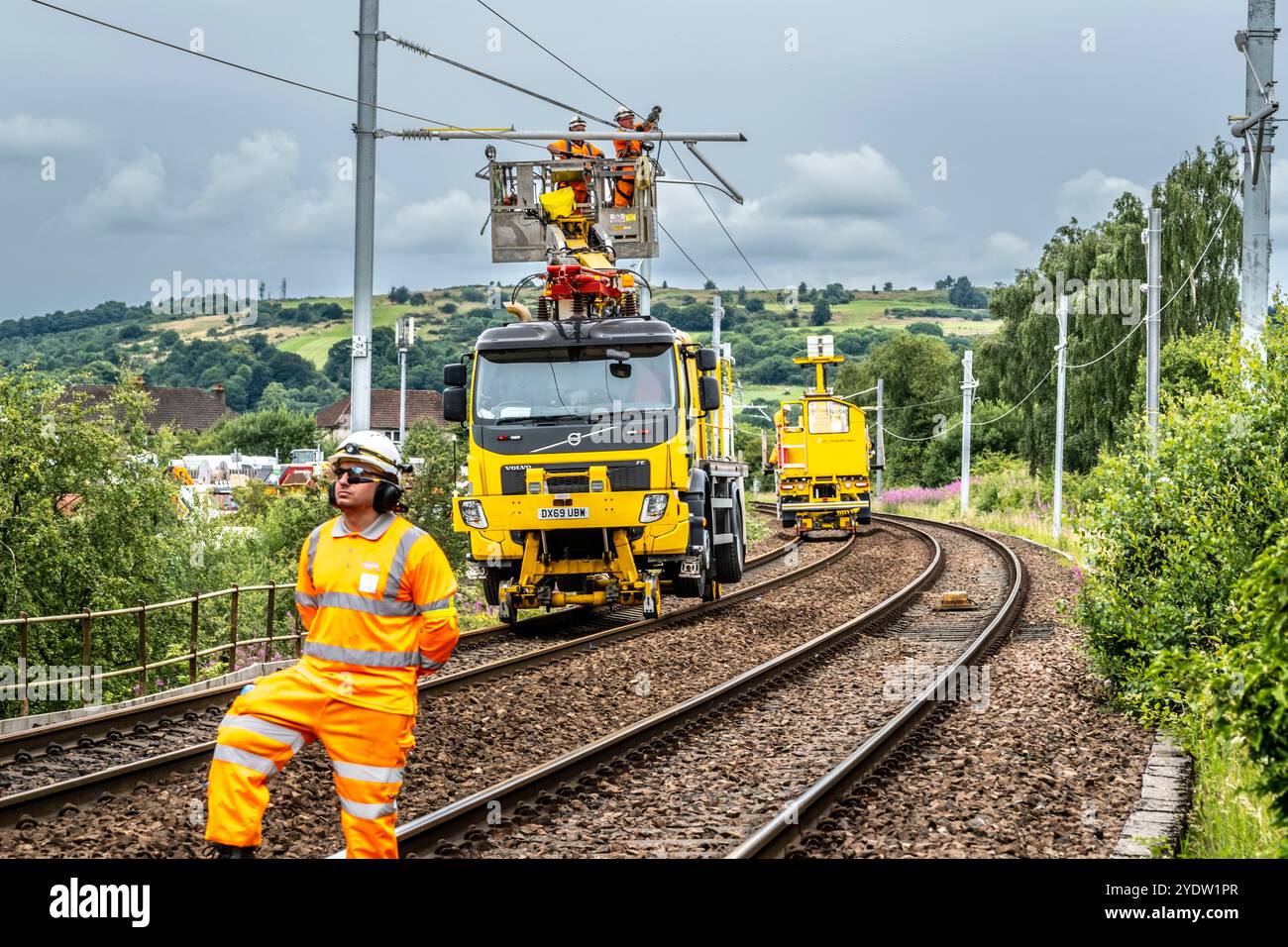 Overhead line maintenance on rail tracks Stock Photo