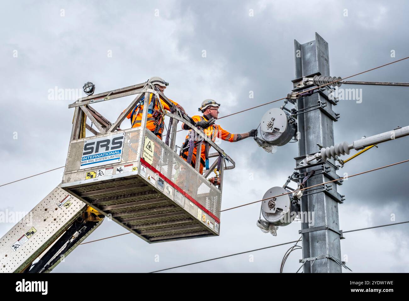 Overhead line maintenance on rail tracks Stock Photo