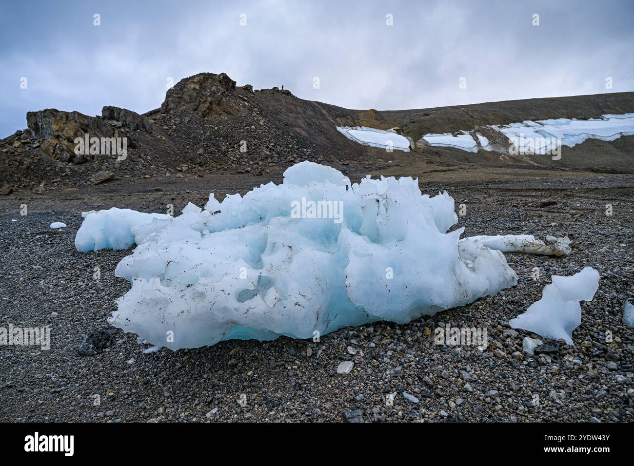 Chunks of ice on a rocky beach, Baffin island, Nunavut, Canadian Arctic, Canada, North America Stock Photo