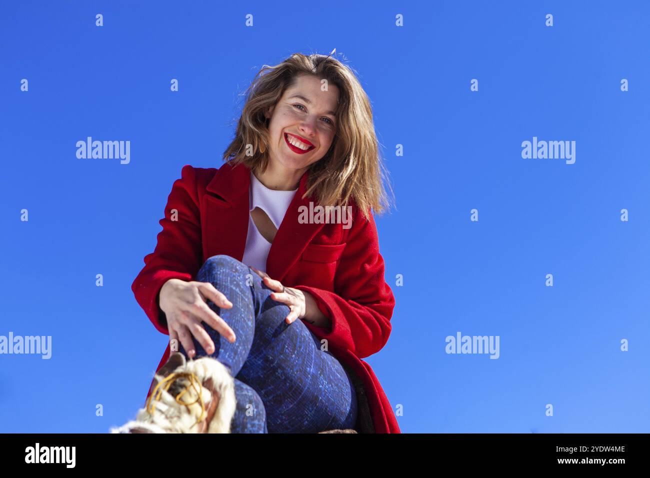 Wearing red top and blue jeans hi-res stock photography and images - Alamy