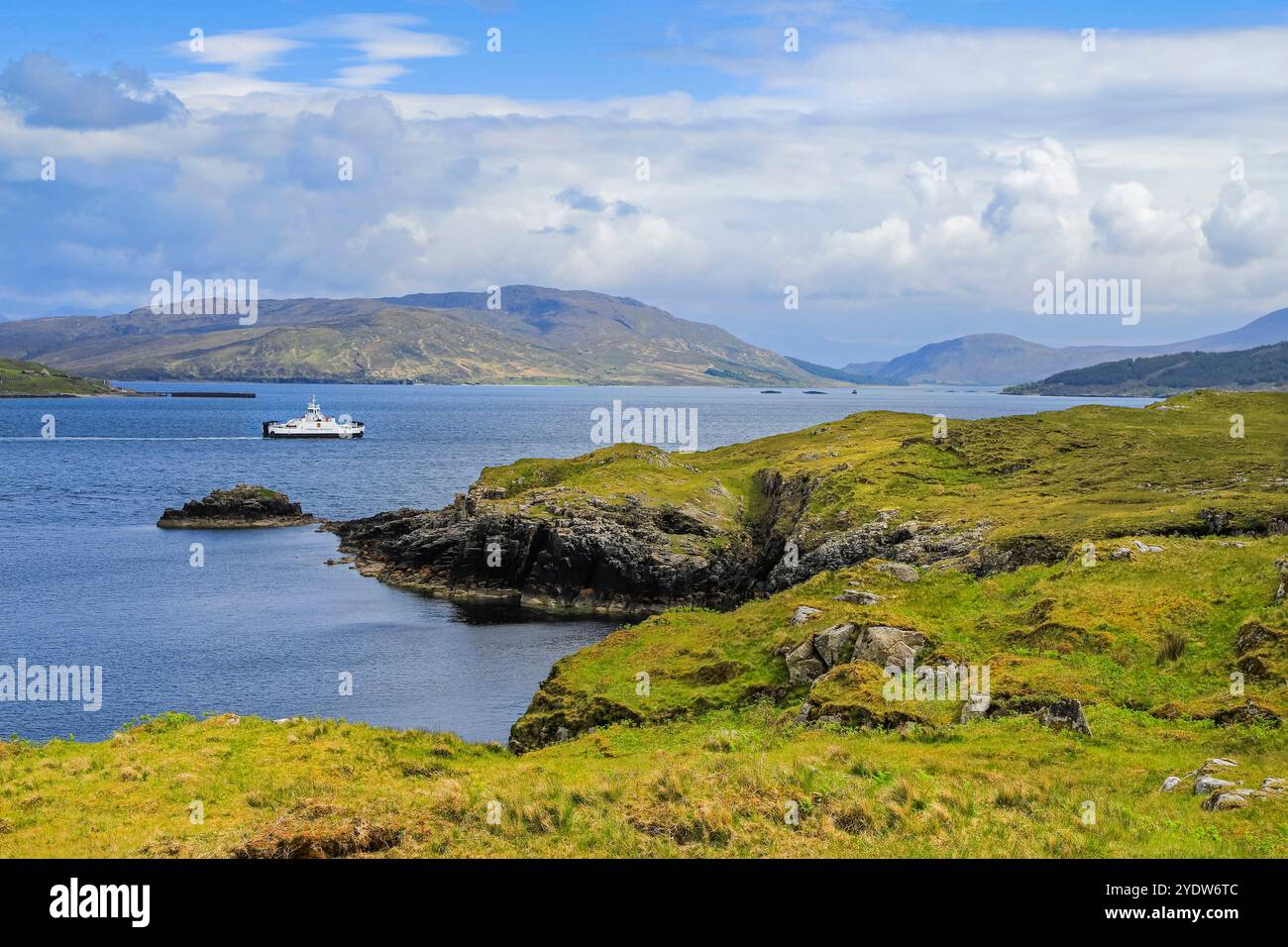 View South across Balmeanach Bay from Braes peninsula to Isle of Scalpay with the Calmac ferry, The Braes, Portree, Skye, Scotland Stock Photo