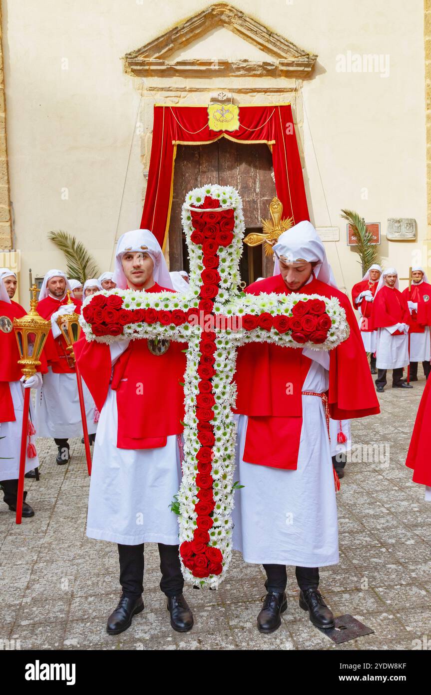 Penitents holding cross made with flowers, Enna, Sicily, Italy, Mediterranean, Europe Stock Photo