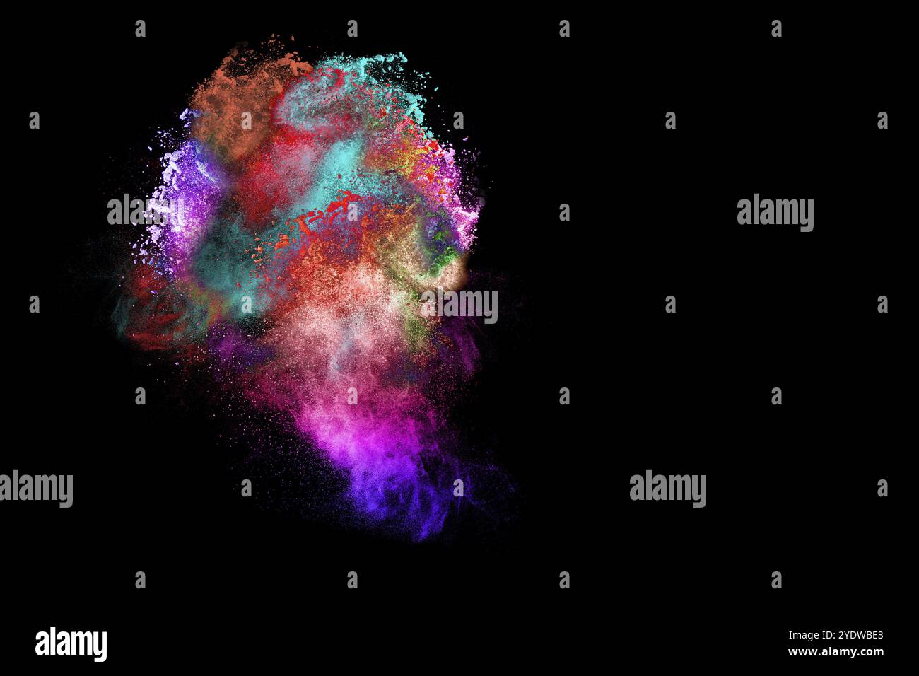 Multicolored powder explosion on black background Stock Photo