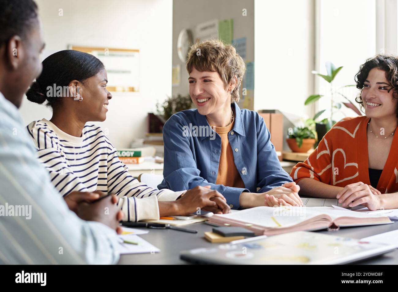 Discussing Project Ideas in Modern Office Setting Stock Photo