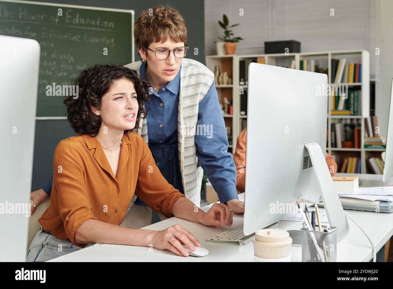 Collaborating on Educational Project in Modern Office Stock Photo