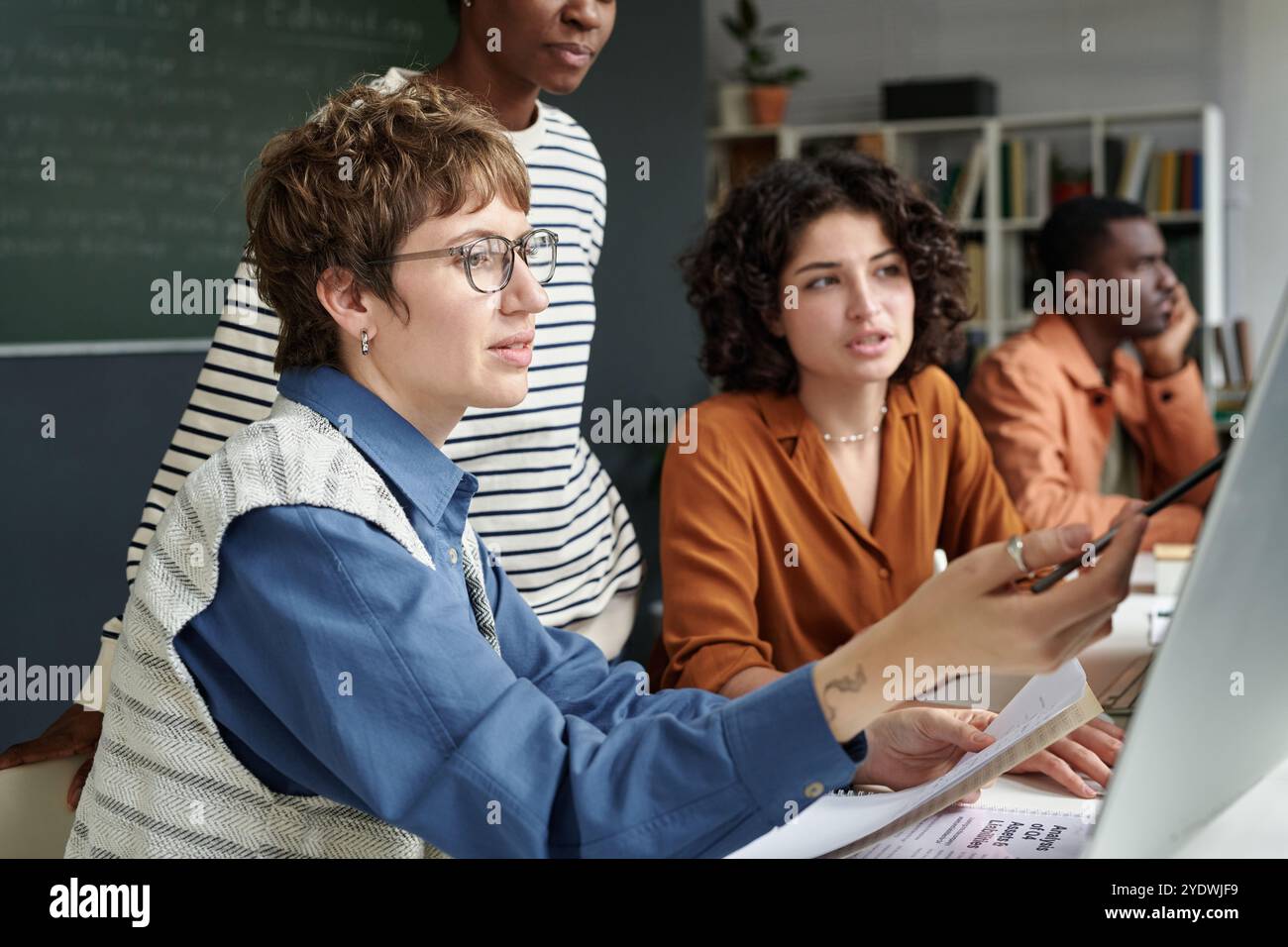 Collaborating on New Project in Modern Office Setting Stock Photo