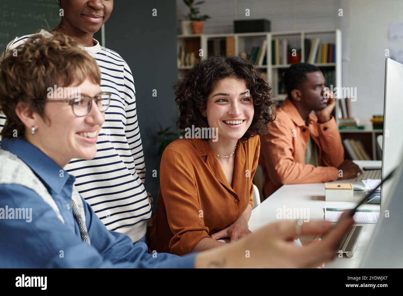 Group Collaborating in Modern Office Setting Stock Photo