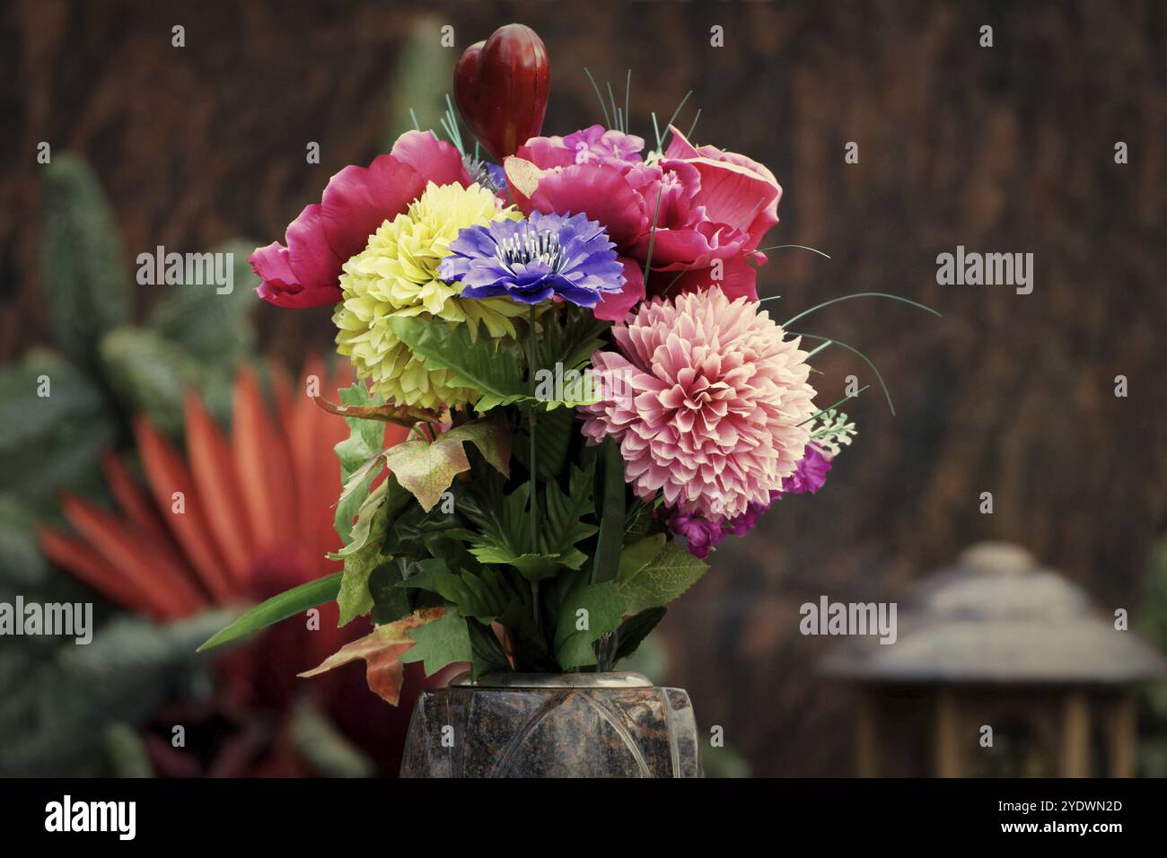 Flower decorations on a grave in a cemetery Stock Photo