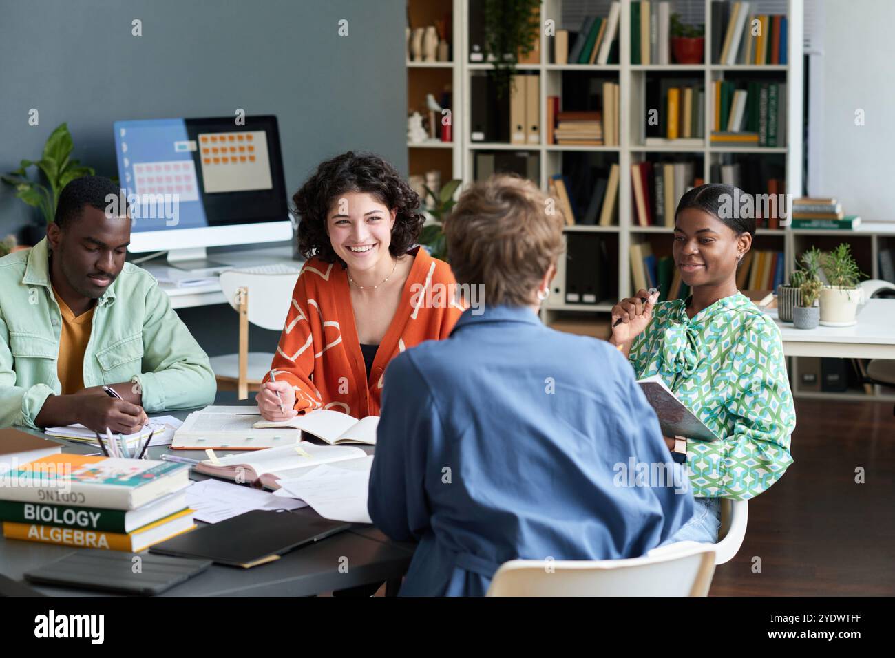 Collaborating in Modern Office Setting with Diverse Group Stock Photo
