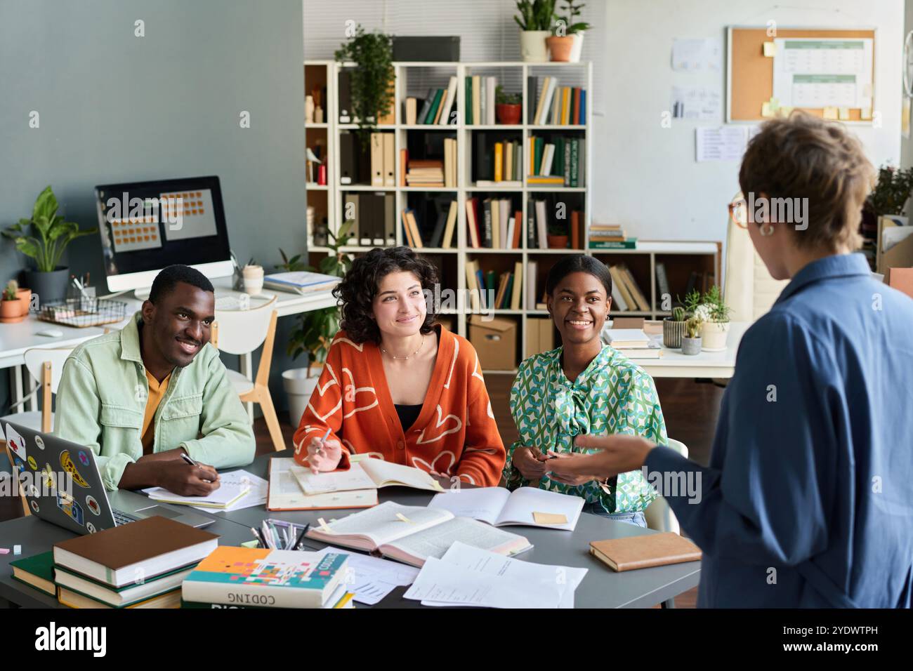 Discussing Team Projects in Bright Office Environment Stock Photo