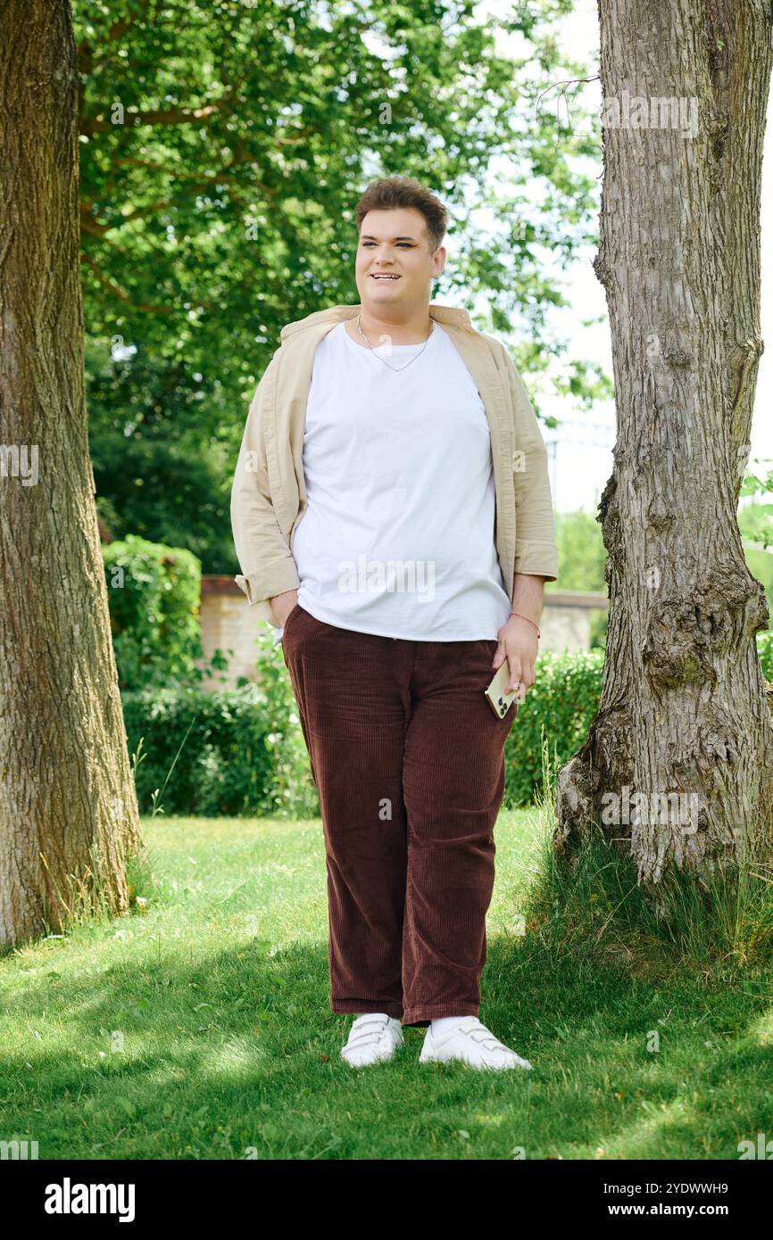 Man standing between two trees hi-res stock photography and images - Alamy