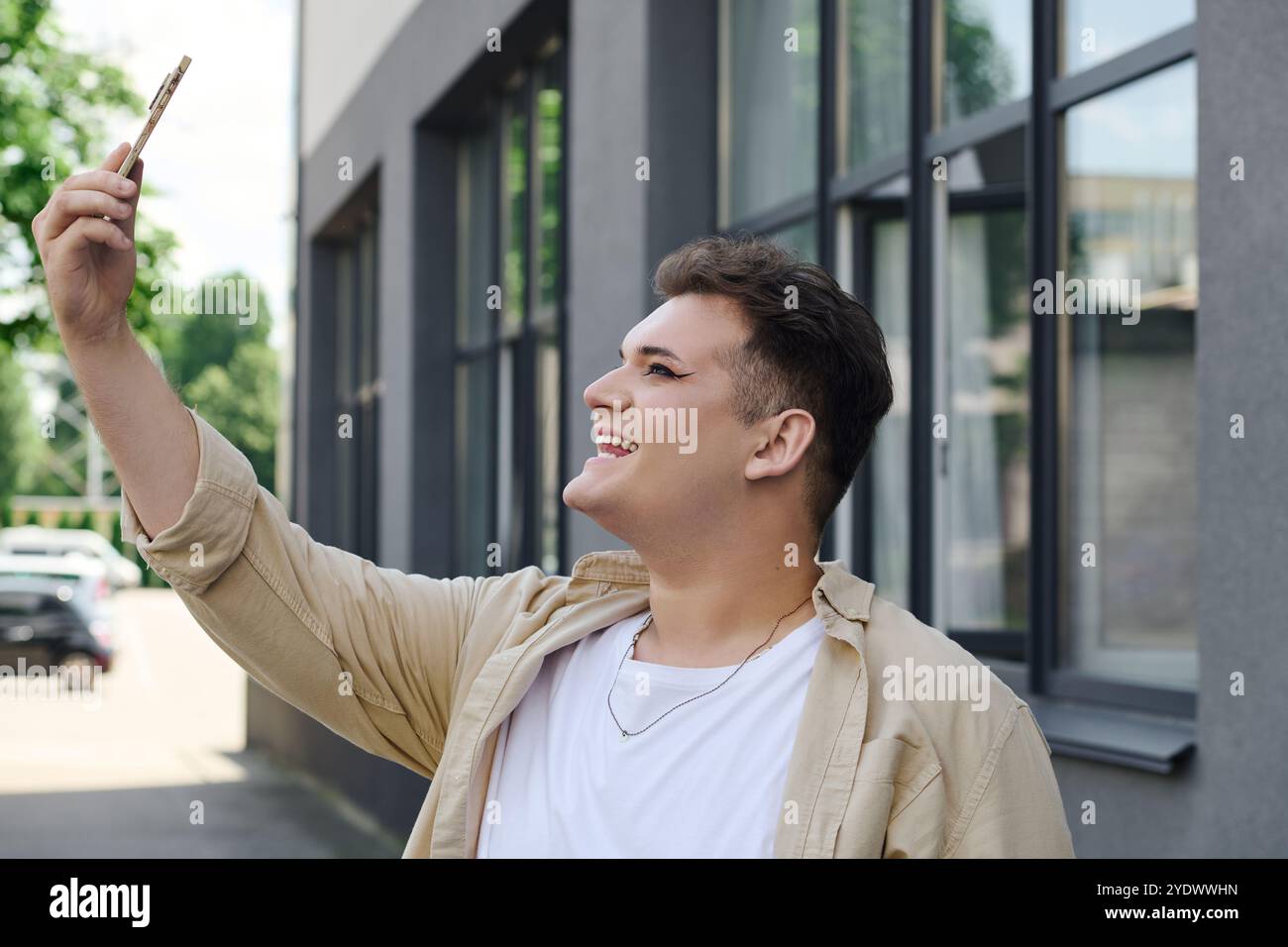 A Cheerful Person Joyfully Takes A Selfie Outdoors With Sunlight a-cheerful-person-joyfully-takes-a-selfie-outdoors-with-sunlight