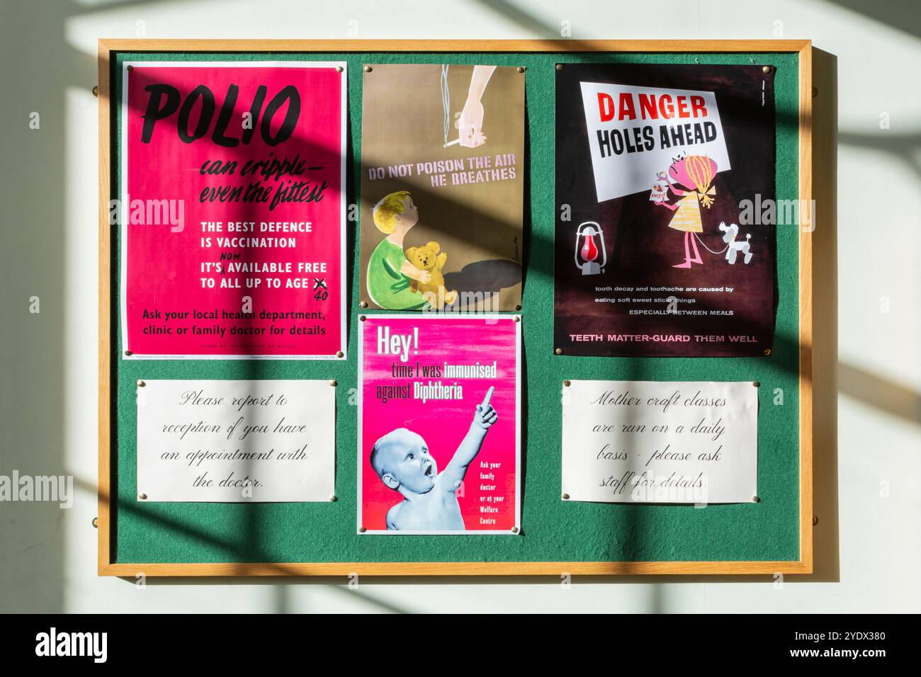 Vintage Health Posters on a Display board in a doctors surgery, UK Stock Photo