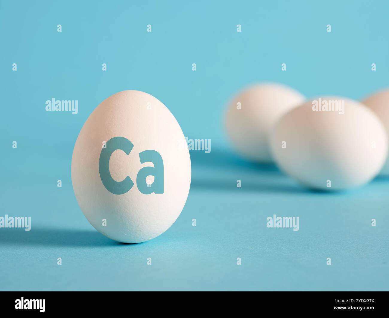 White egg with Calcium Ca label on it. Healthy nutrition and daily calcium intake concept. Stock Photo