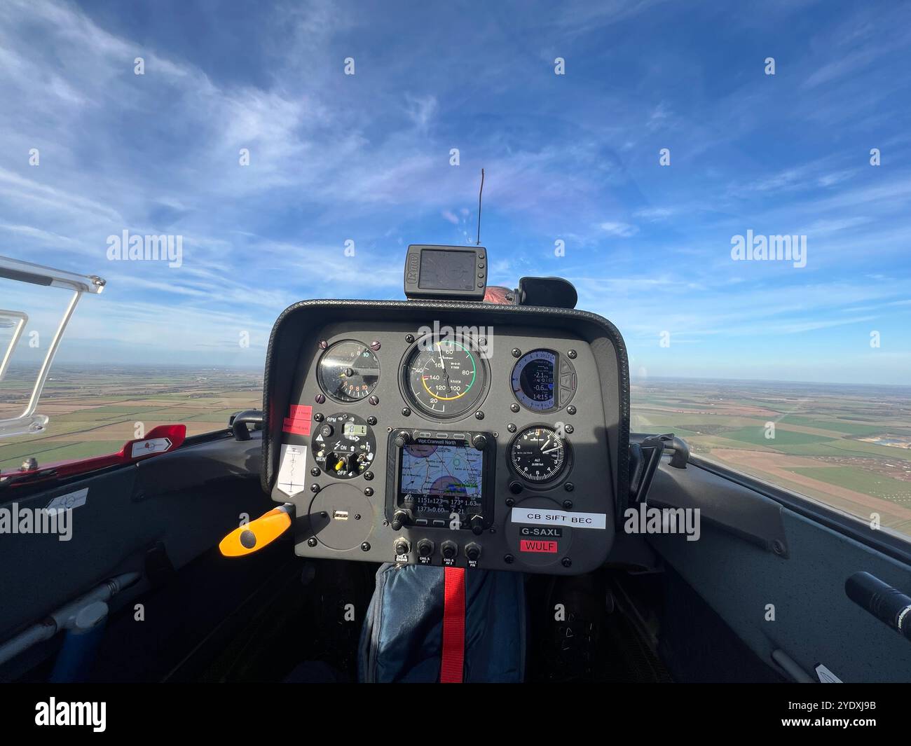 Pilot view from the rear seat of a Schempp-Hirth Duo Discus XLT high performance sailplane whilst in flight. Instrument panel and gauges visable. - Smartphone Captured Stock Image