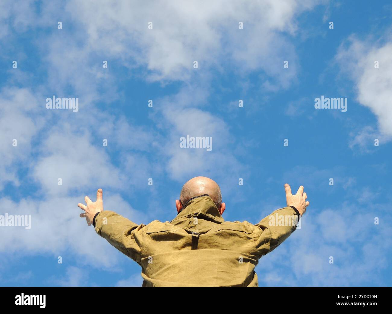 Back view man raises hi-res stock photography and images - Alamy