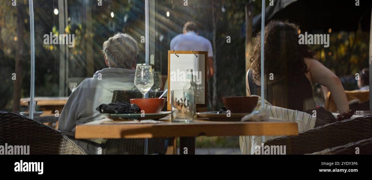 Backlit woman looking out window hi-res stock photography and images ...