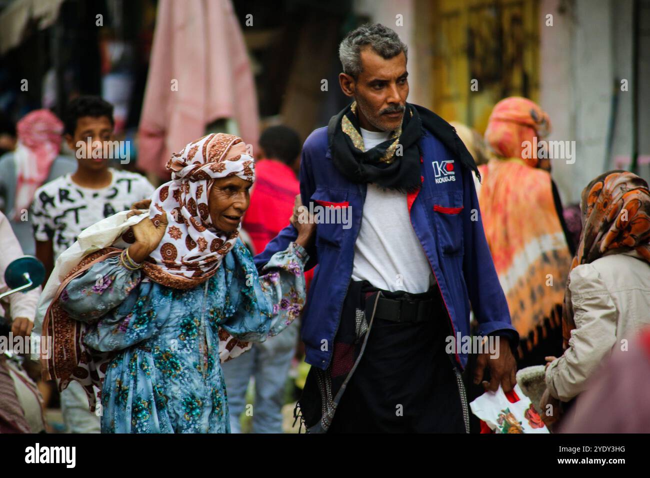 The historic Bab Al- Musa market in the Yemeni city of Taiz becomes very busy with residents shopping during Ramadan. The construction of the market of Bab Musa and the walls of the old city dates back to the Ottoman era in Yemen, with the market developing with the construction of the Bab Al-Musa Gate in the eighth century. Taiz remained a walled city until 1948 when Imam Ahmed allowed for expansion beyond its fortified wall. Taiz, which is located in south-western Yemen, is the third largest city in Yemen, and was its cultural capital until before becoming deeply entangled in the Yemeni conf Stock Photo