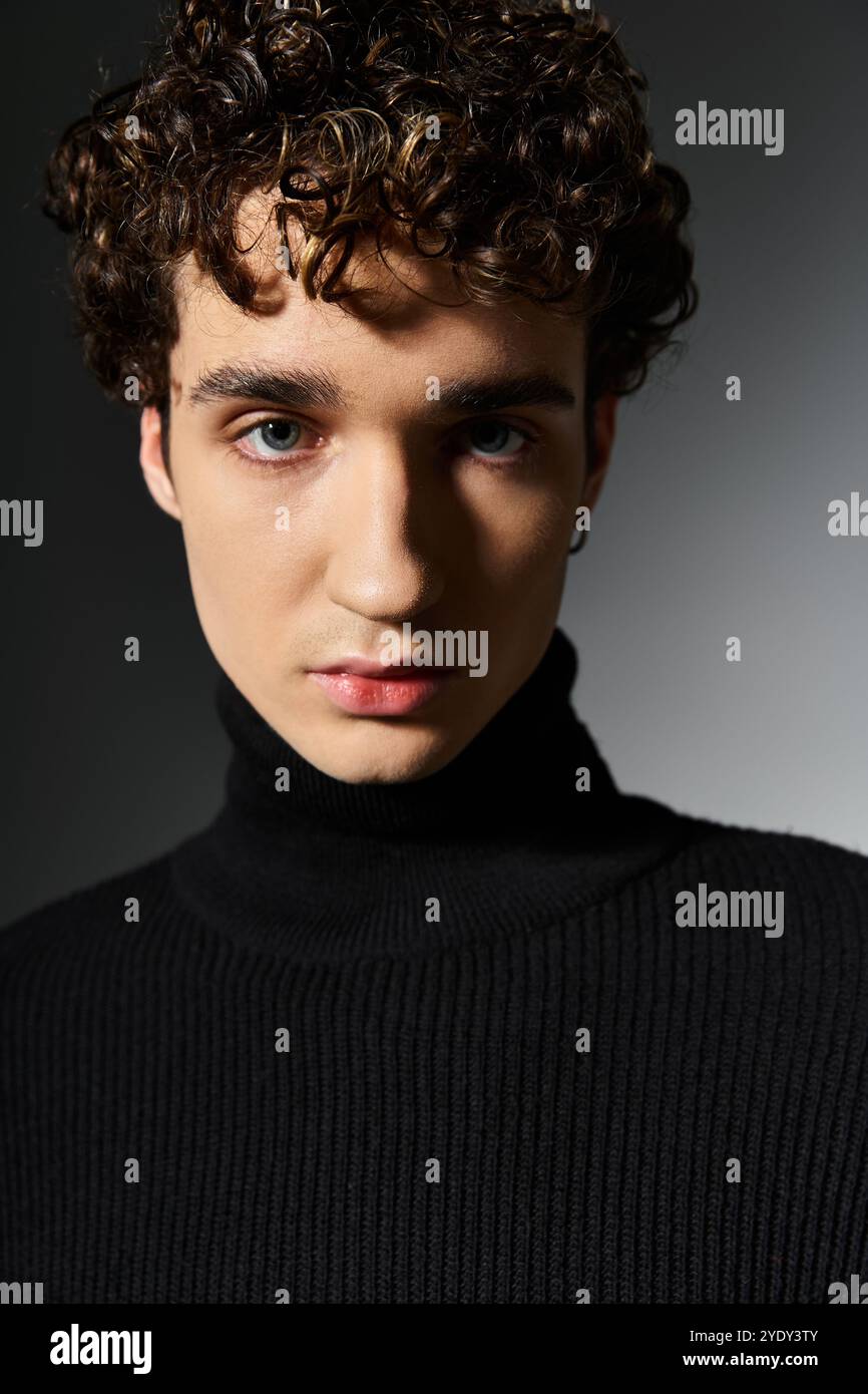 A handsome young man showcases his style with curly hair and a black ...