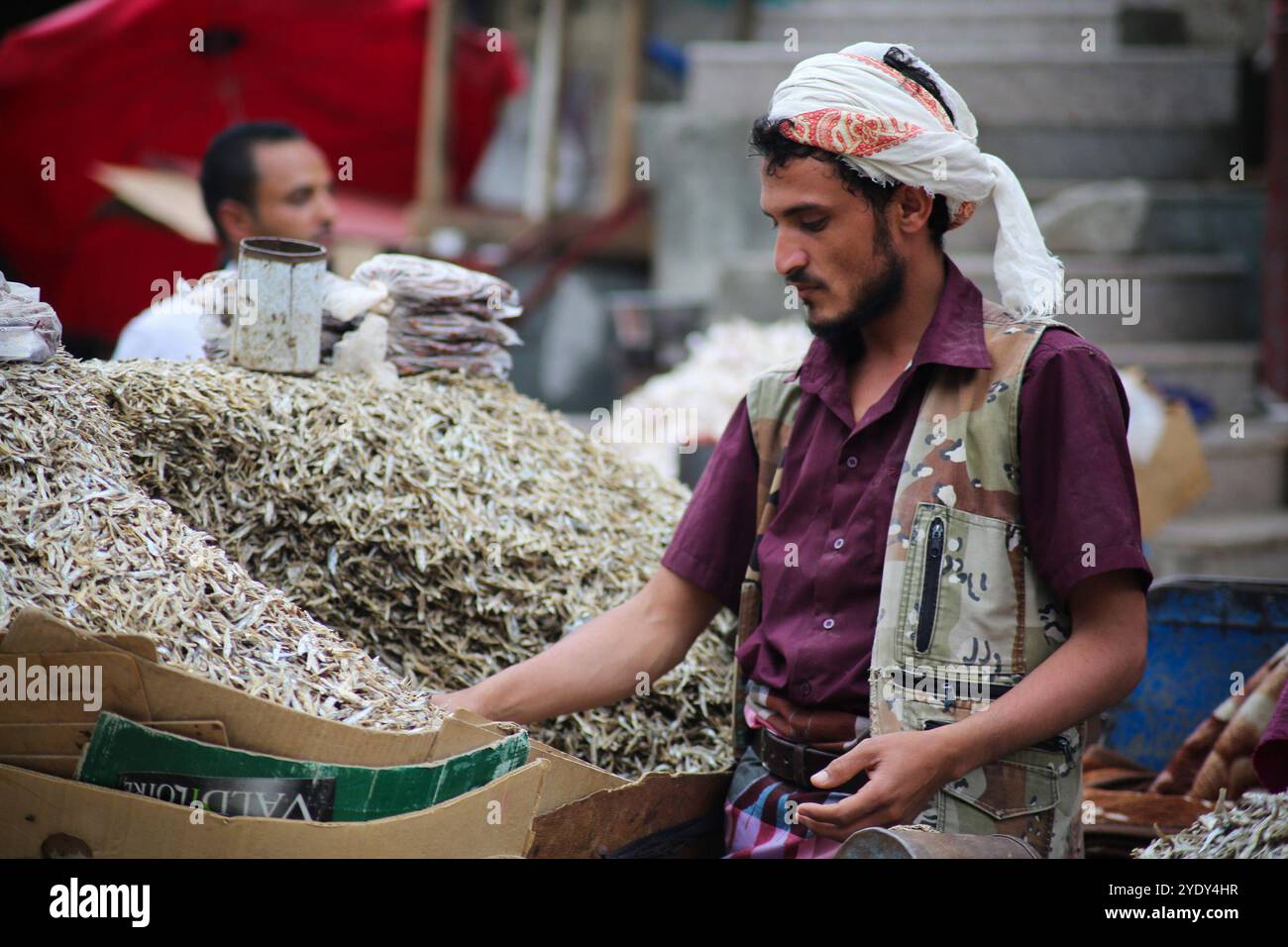 The historic Bab Al- Musa market in the Yemeni city of Taiz becomes very busy with residents shopping during Ramadan. The construction of the market of Bab Musa and the walls of the old city dates back to the Ottoman era in Yemen, with the market developing with the construction of the Bab Al-Musa Gate in the eighth century. Taiz remained a walled city until 1948 when Imam Ahmed allowed for expansion beyond its fortified wall. Taiz, which is located in south-western Yemen, is the third largest city in Yemen, and was its cultural capital until before becoming deeply entangled in the Yemeni conf Stock Photo