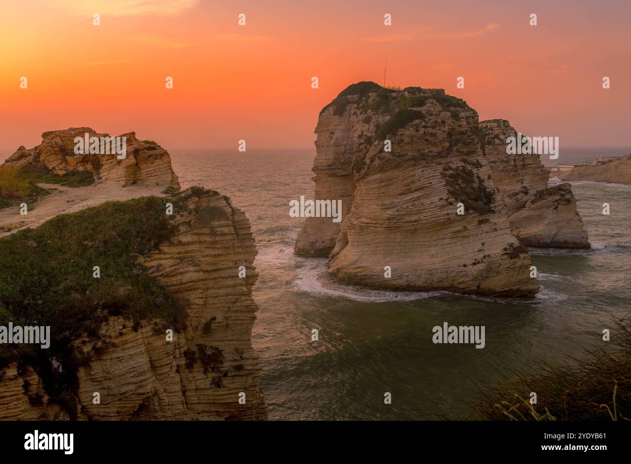 The scenic view of Pigeons' Rock (Raouche rocks), Beirut landmark on the Mediterranean sea coast, during the beautiful sunset. Stock Photo