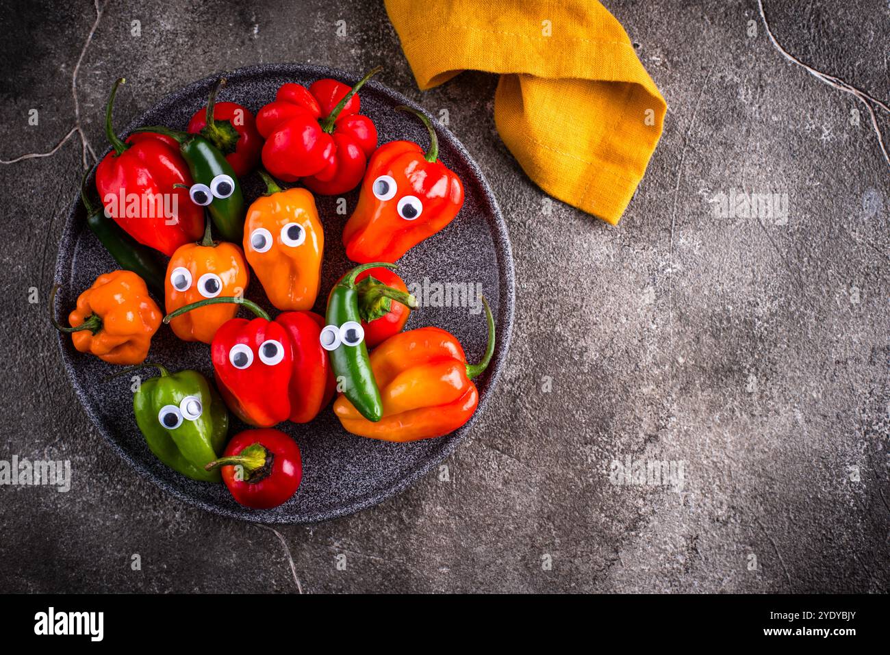 Cute color bell pepper with eyes Stock Photo - Alamy