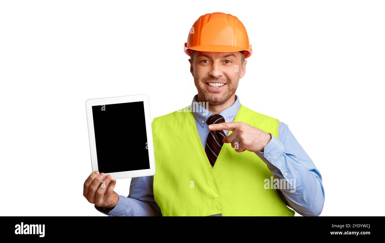 Builder Showing Tablet Pointing Finger At Empty Screen, White Background Stock Photo