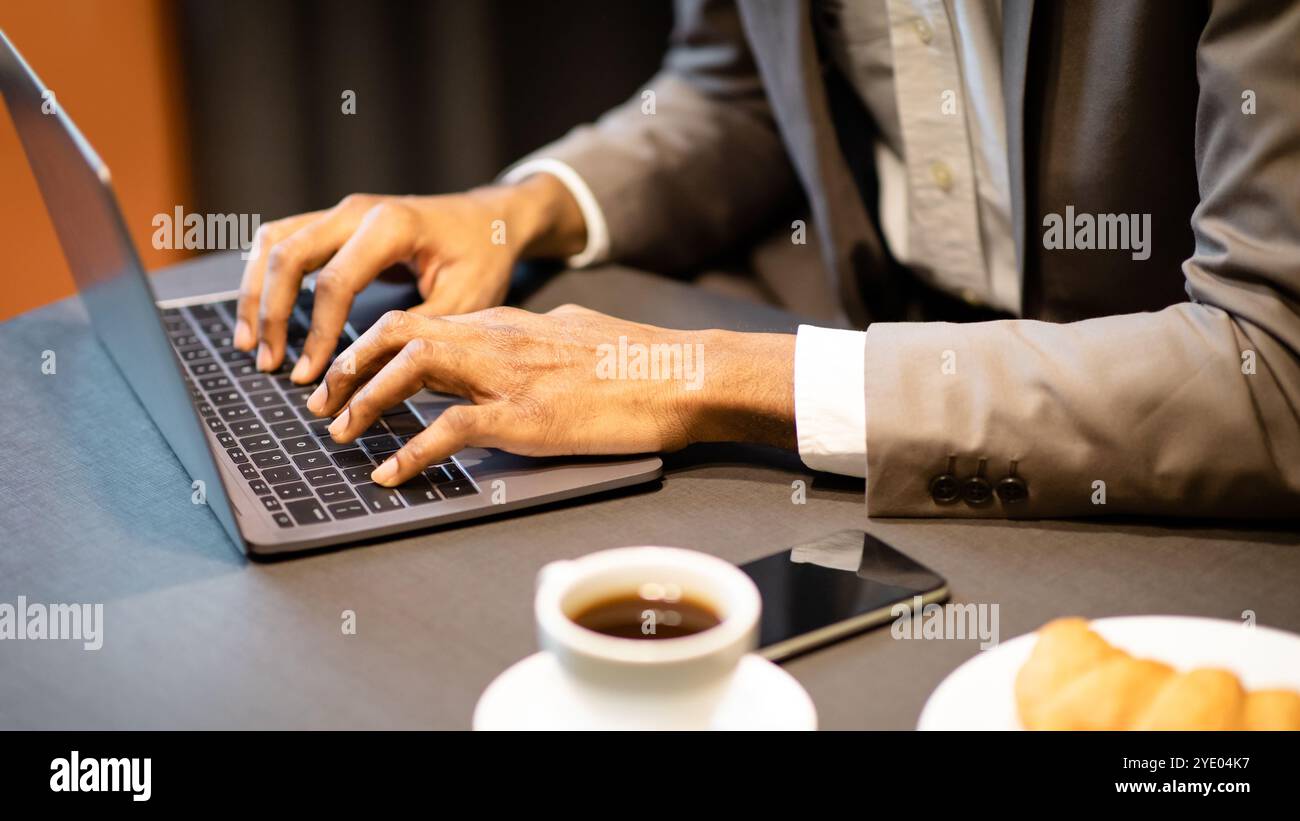 Cropped image of busy guy using computer Stock Photo